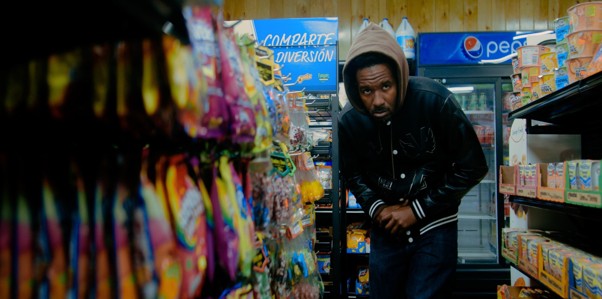 A character framed by colorful store shelves